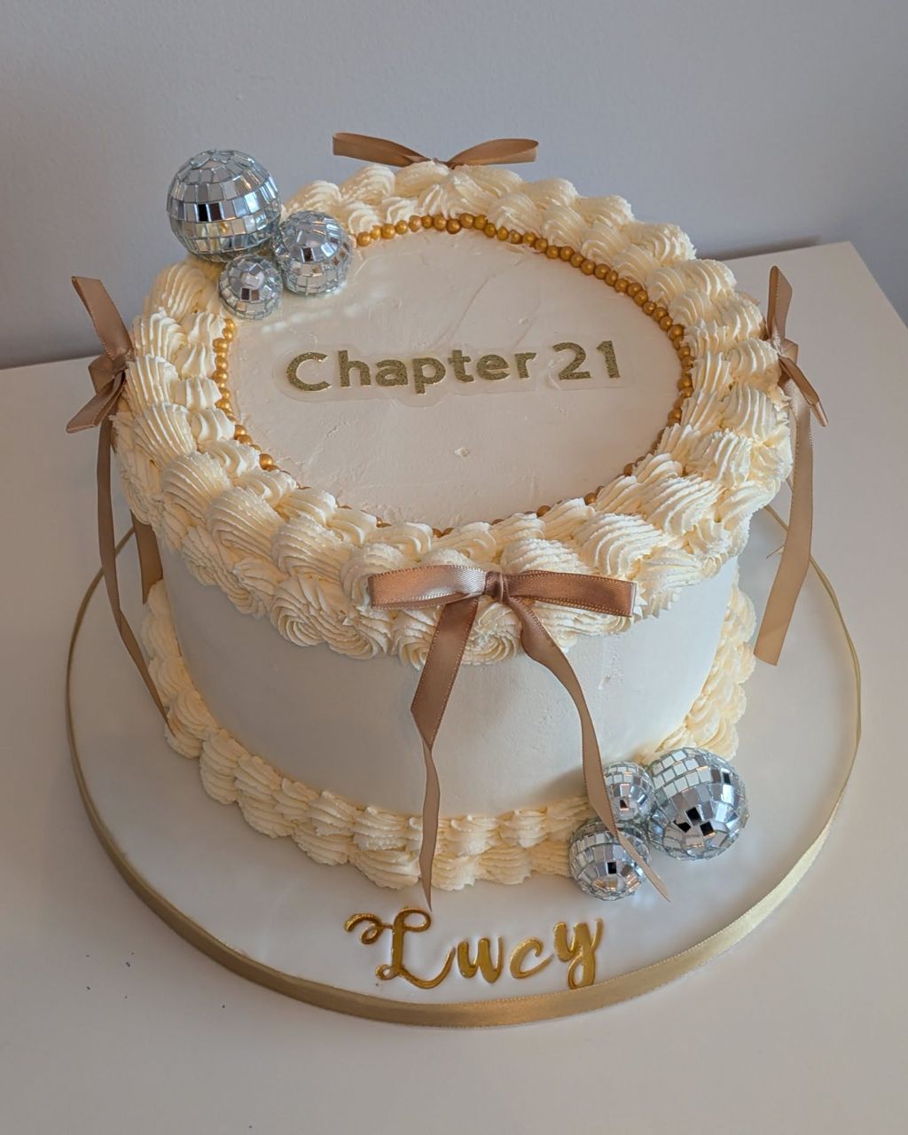 Chapter 21 birthday cake with piped border and ribbon bows